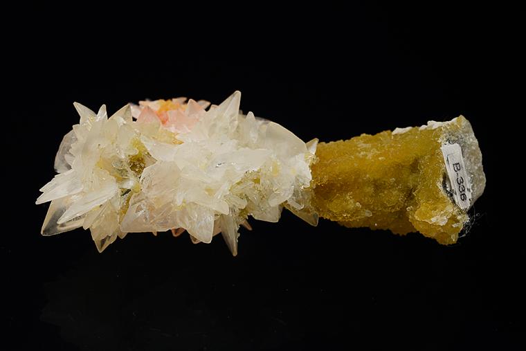 COLEMANITE with REALGAR on CALCITE